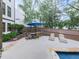 An inviting backyard patio area, perfect for outdoor dining and lounging by the pool at 215 Haleys Ct, Woodstock, GA 30188