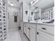 Well-lit bathroom featuring a vanity with storage, tiled floor, and a shower-tub combination at 215 Haleys Ct, Woodstock, GA 30188