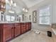Bathroom featuring double vanity, modern fixtures, and natural light from the window at 215 Haleys Ct, Woodstock, GA 30188