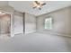Spacious bedroom with neutral colors and light carpet and a bathroom in view at 215 Haleys Ct, Woodstock, GA 30188