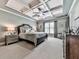 Elegant bedroom features a tray ceiling, ceiling fan, and neutral carpet at 215 Haleys Ct, Woodstock, GA 30188