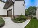 A home's exterior showcases a two-car garage with a well-manicured landscape at 215 Haleys Ct, Woodstock, GA 30188