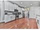 Beautiful kitchen with white cabinets, stainless appliances, and abundant counter space at 215 Haleys Ct, Woodstock, GA 30188
