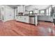 Modern kitchen with white cabinets, stainless steel appliances, and hardwood floors at 215 Haleys Ct, Woodstock, GA 30188