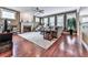 Bright and airy living room featuring a fireplace, hardwood floors, large windows, and comfortable furniture at 215 Haleys Ct, Woodstock, GA 30188