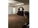 Expansive bedroom features carpet floors, a dark dresser with mirror and a flat screen television on a wood stand at 6074 Locklear Way, Douglasville, GA 30134