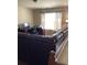 Living room with a leather sofa and an office desk area at 6074 Locklear Way, Douglasville, GA 30134