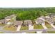 An aerial view of a neighborhood showcasing houses with well-maintained lawns and landscaping at 7730 Tiberon Pkwy, Cumming, GA 30028