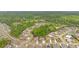 Aerial view of the neighborhood showcasing well-maintained homes, lush trees, and manicured landscaping at 7730 Tiberon Pkwy, Cumming, GA 30028