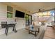 Spacious back porch with outdoor seating, a grill, and a view of the backyard; ideal for relaxation and entertainment at 7730 Tiberon Pkwy, Cumming, GA 30028
