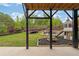 Spacious backyard features a trampoline, playground, swing, picnic table and cozy Adirondack seating at 7730 Tiberon Pkwy, Cumming, GA 30028