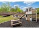 Outdoor recreational area with playground, trampoline, and firepit seating at 7730 Tiberon Pkwy, Cumming, GA 30028