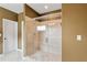 Bathroom showcasing a glass-enclosed shower with tile surround and built-in bench at 7730 Tiberon Pkwy, Cumming, GA 30028