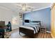 The bedroom is bright with a modern ceiling fan and built-in bookcase at 7730 Tiberon Pkwy, Cumming, GA 30028
