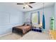 bedroom with light blue walls and carpet, featuring a bed, window and other furniture at 7730 Tiberon Pkwy, Cumming, GA 30028