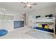 Comfortable bedroom offers a bunk bed, chalkboard wall, neutral carpet and cozy beanbag chair at 7730 Tiberon Pkwy, Cumming, GA 30028