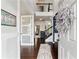 Bright foyer with hardwood floors, a staircase, and decorative accents at 7730 Tiberon Pkwy, Cumming, GA 30028