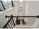 Bright foyer showcases a grand chandelier and a view of the front door from the staircase at 7730 Tiberon Pkwy, Cumming, GA 30028