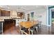 Spacious kitchen, kitchen island, stainless appliances, with view to large dining room at 7730 Tiberon Pkwy, Cumming, GA 30028