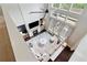 Bright and airy living room with fireplace, tall windows, hardwood floors and plush sectional sofa at 7730 Tiberon Pkwy, Cumming, GA 30028