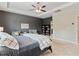 Comfortable main bedroom featuring a tray ceiling, neutral carpet, and sitting area at 7730 Tiberon Pkwy, Cumming, GA 30028