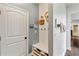 Charming mudroom with built-in bench, storage cubbies, hooks, and a door leading to the exterior at 7730 Tiberon Pkwy, Cumming, GA 30028