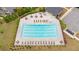 Community pool with plenty of lounge chairs and tables, perfect for relaxing and enjoying the outdoors at 7730 Tiberon Pkwy, Cumming, GA 30028