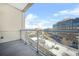 Balcony with glass railing offering city views on a sunny day at 1100 Howell Mill Nw Rd # 505, Atlanta, GA 30318