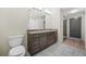 Bathroom with double sink vanity, and tile flooring and door at 1100 Howell Mill Nw Rd # 505, Atlanta, GA 30318