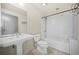 Cozy bathroom with a tiled bathtub, shower, and a large mirror over the sink at 1100 Howell Mill Nw Rd # 505, Atlanta, GA 30318