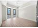Bright bedroom features hardwood floors, a ceiling fan, and two large windows with great views at 1100 Howell Mill Nw Rd # 505, Atlanta, GA 30318