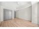 Bright bedroom featuring hardwood floors, a ceiling fan, and neutral wall paint at 1100 Howell Mill Nw Rd # 505, Atlanta, GA 30318