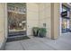 Contemporary building entrance with glass doors, potted plants, and modern design at 1100 Howell Mill Nw Rd # 505, Atlanta, GA 30318