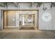 Modern building entrance featuring a glass door, prominent signage, and clear visibility at 1100 Howell Mill Nw Rd # 505, Atlanta, GA 30318