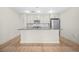 Modern kitchen with a central island, stainless steel appliances, and ample cabinet space at 1100 Howell Mill Nw Rd # 505, Atlanta, GA 30318