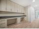 Spacious office area features built-in storage cabinets and a long desk perfect for working from home at 1100 Howell Mill Nw Rd # 505, Atlanta, GA 30318