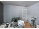 Bedroom featuring light blue walls, hardwood floors, and a white door with an over-the-door shoe organizer at 3162 Citrus Ct, Decatur, GA 30034