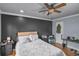 Spacious bedroom features hardwood floors, a ceiling fan, and lots of natural light at 3162 Citrus Ct, Decatur, GA 30034