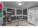 Versatile room features a table, tile floors, shelving, and natural light streaming through glass panel doors at 3162 Citrus Ct, Decatur, GA 30034