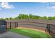 Fenced backyard that has a concrete patio and a small grass area with mulch border at 355 Niles Ct # 2, Marietta, GA 30060