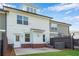 Back of house with white siding, brick foundation, fenced yard and grassy area at 355 Niles Ct # 2, Marietta, GA 30060