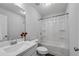 Bathroom with marble sink top, white cabinets, and shower over tub with shower curtain at 355 Niles Ct # 2, Marietta, GA 30060