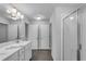 Bathroom features a double sink vanity, gray tile flooring and a glass shower at 355 Niles Ct # 2, Marietta, GA 30060