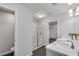 Modern bathroom featuring double sinks, white cabinets, glass enclosed shower, and walk-in closet at 355 Niles Ct # 2, Marietta, GA 30060