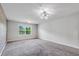 Bright bedroom with brick accent wall, carpet floors, updated lighting, and natural light at 355 Niles Ct # 2, Marietta, GA 30060