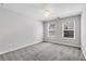 Neutral bedroom with carpet, chandelier, and two windows at 355 Niles Ct # 2, Marietta, GA 30060