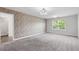 Spacious bedroom with brick accent wall, carpet floors, recessed lighting, and natural light at 355 Niles Ct # 2, Marietta, GA 30060