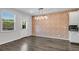 Open dining area featuring an exposed brick wall and modern lighting, ready for entertaining at 355 Niles Ct # 2, Marietta, GA 30060