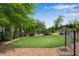 Spacious fenced dog park area with a grassy area, bench seating, and waste station at 355 Niles Ct # 2, Marietta, GA 30060