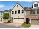 Charming townhome features a painted brick facade, attached garage, and well-maintained landscaping at 355 Niles Ct # 2, Marietta, GA 30060